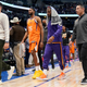 Phoenix Suns forward Mikal Bridges (25) and guard Chris Paul, second from right, walk off the court after Game 4 of an NBA basketball second-round playoff series against the Dallas Mavericks, Sunday, May 8, 2022, in Dallas.